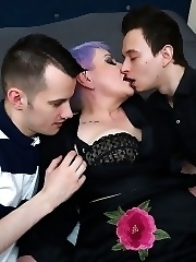 Curvy mama is taking two young cocks at once from her toyboys